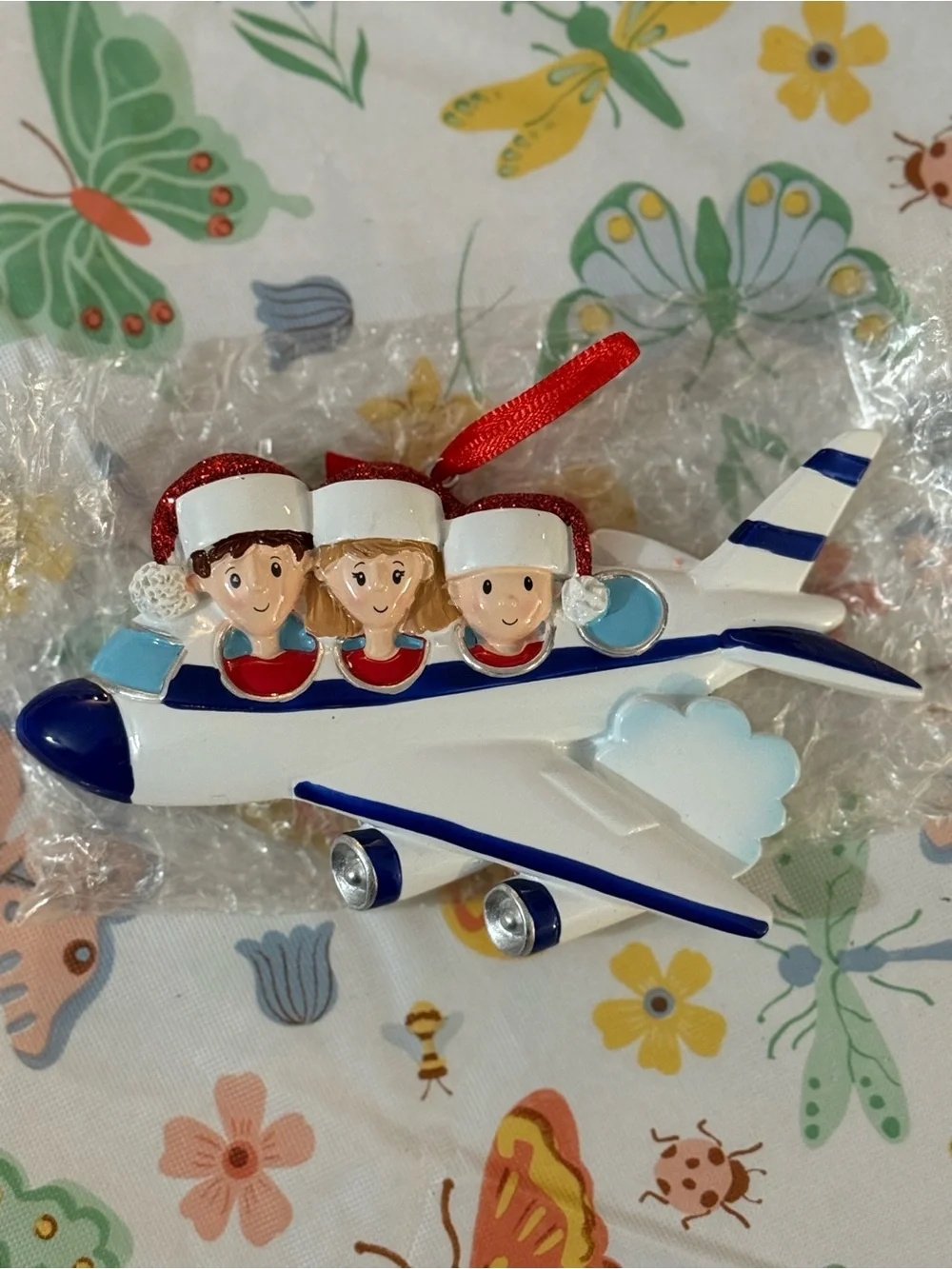 Festive Airplane Ornament with Three Santa Hats Family of 3